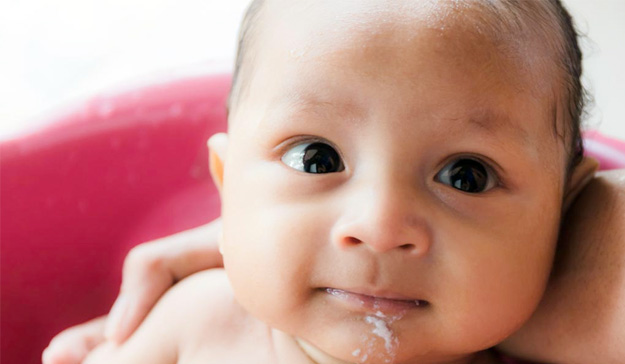 Baby vomiting curdled sales milk